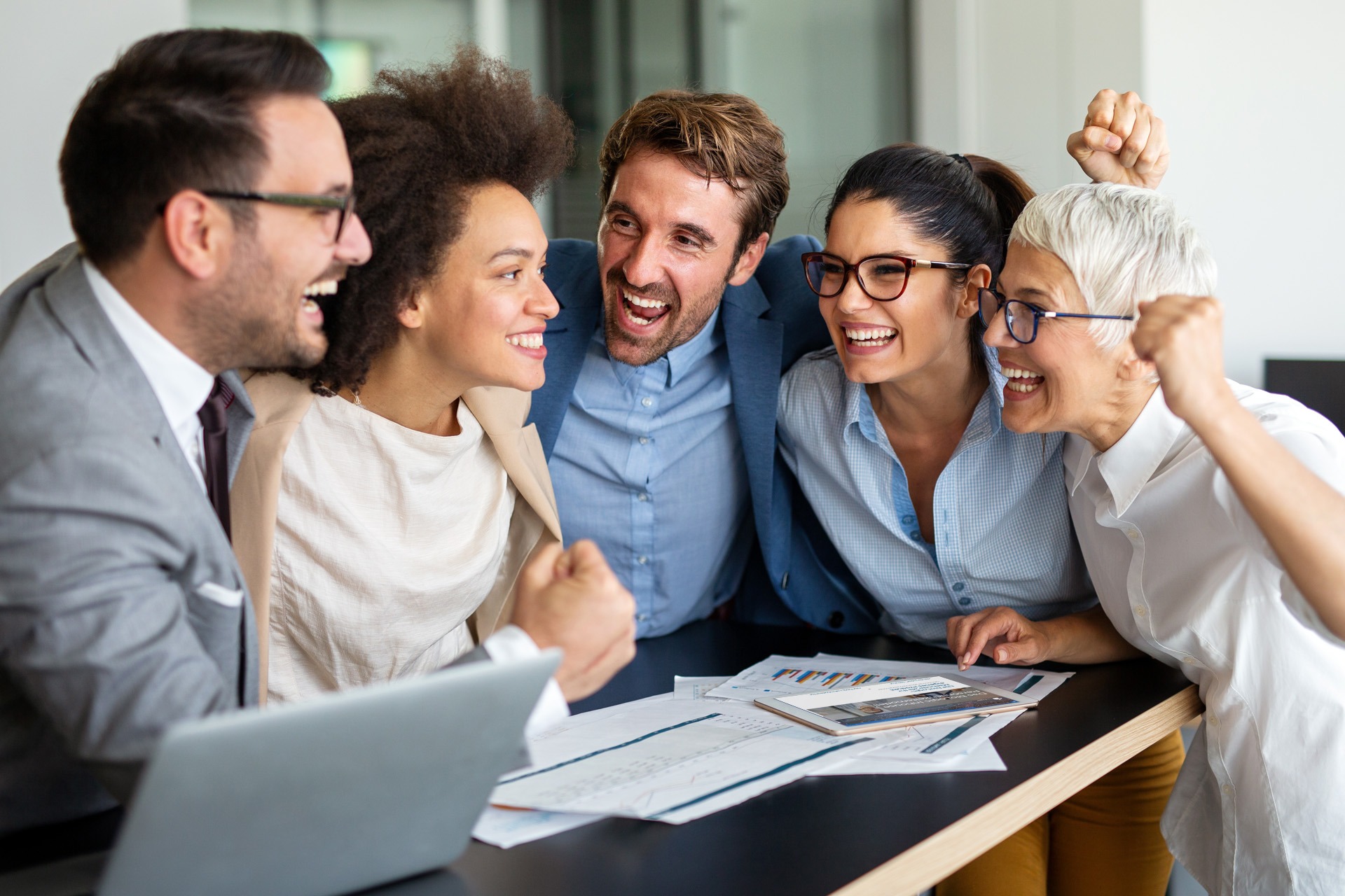 Portrait of successful business people working together in corporate office. Business teamwork concept